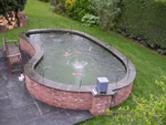 Kidney shaped pond fibreglassed by GRP photo 10