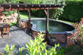 Kidney shaped pond fibreglassed by GRP photo 11